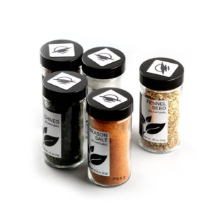 Square WayTag magnets attached to the tops of five spice shakers